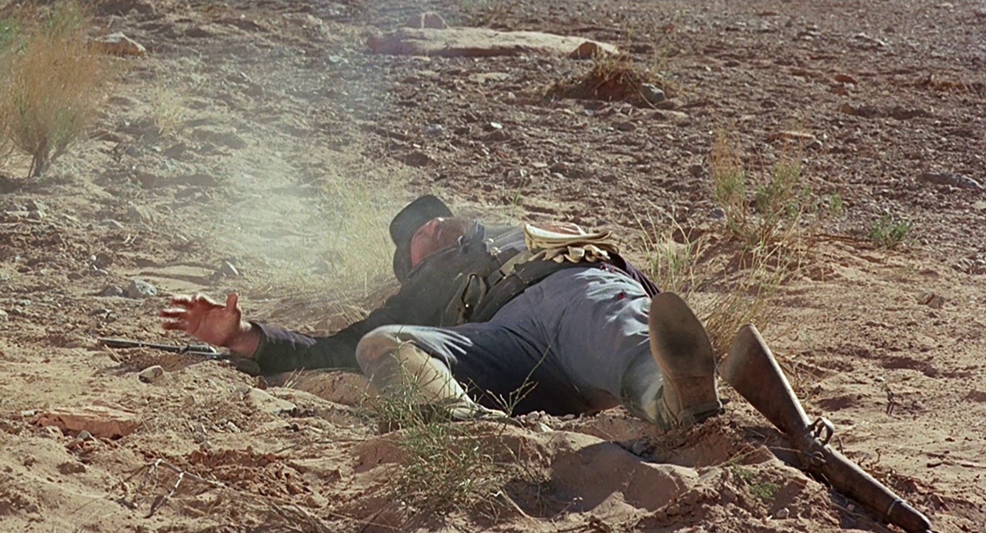 Shot cavalryman lies in the dust.